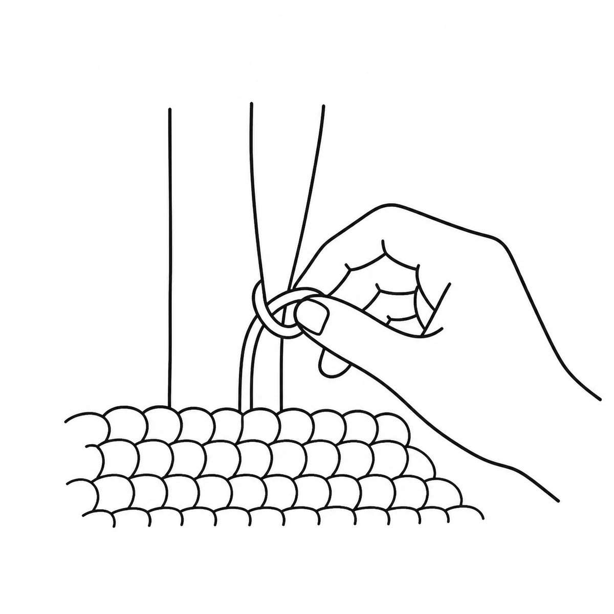 A hand tying a rug knot